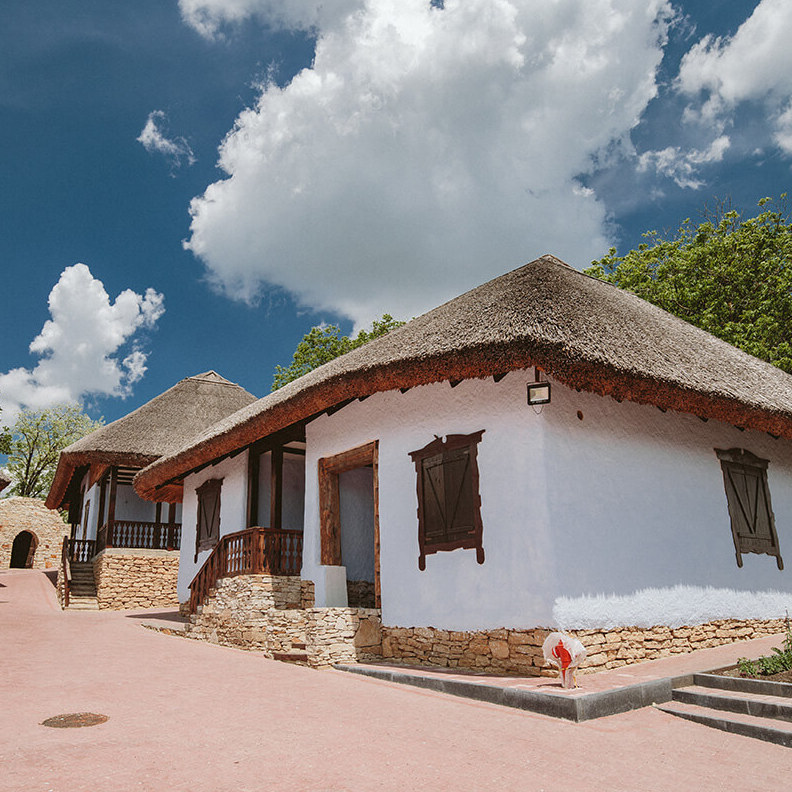 Traditional thatched guest cottage at ASCONI Winery