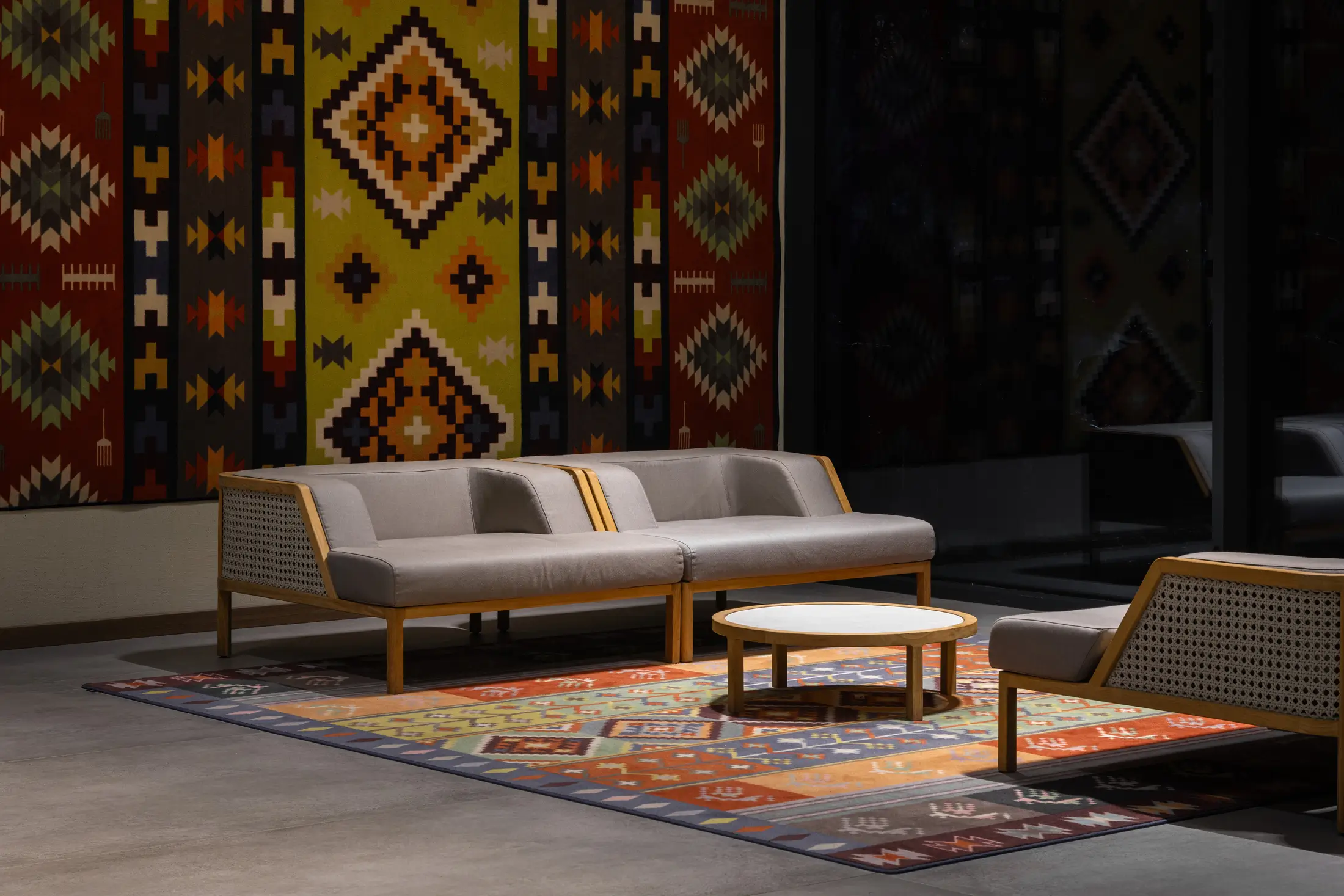 Lounge at MIMI Hotel with a traditional patterned wall hanging
